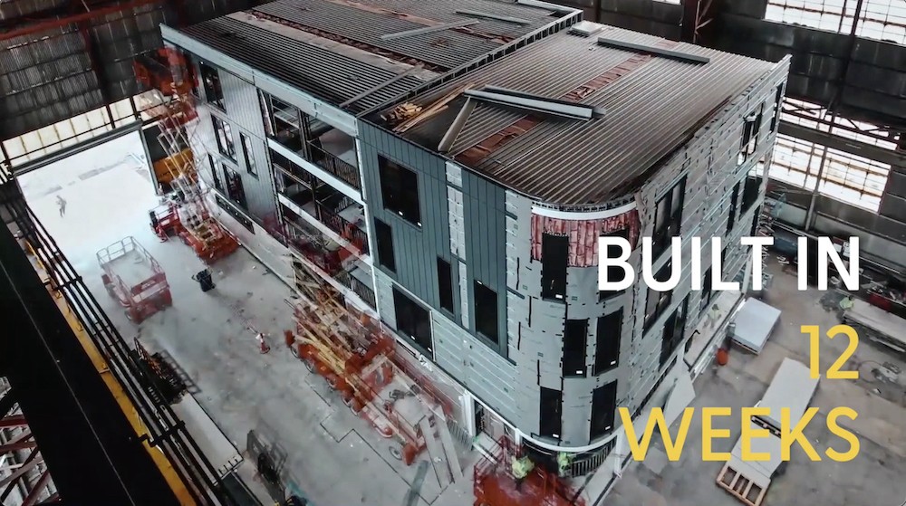 Construction of pre-fab building modules with text saying built in 12 weeks